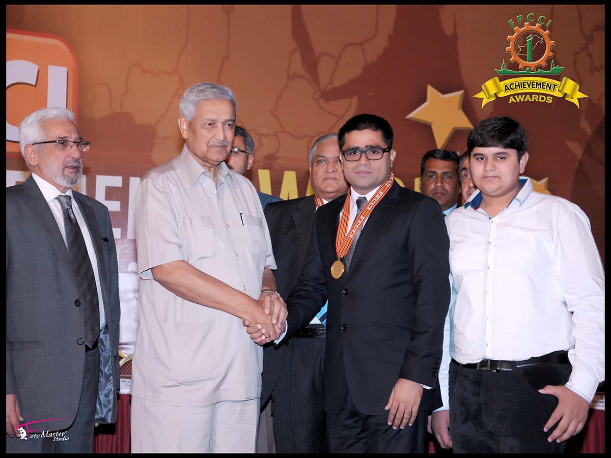 Shaking hands with Dr. Abdul Qadeer Khan after receiving Achievement Gold Medal at Karachi in the year 2012.